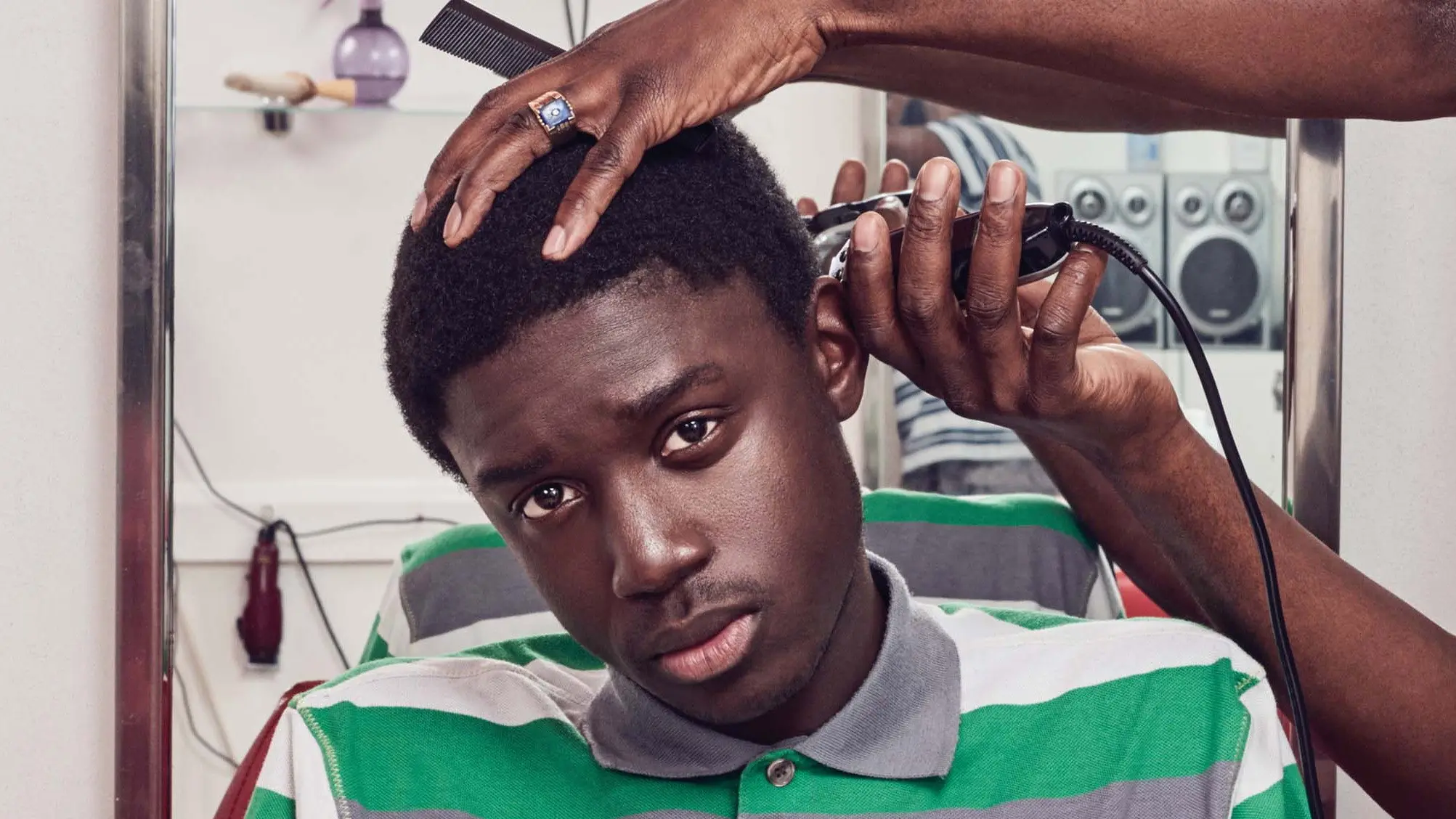 National Theatre Live: Barber Shop Chronicles backdrop